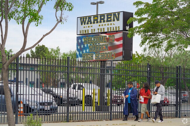 A large sign welcomes students to Warren High School in Downey, California.