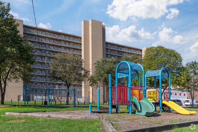 A colorful playground sits just behind the main apartment building in Northview Heights.