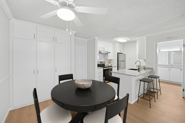 Renovated Package I kitchen and dining area with hard surface flooring