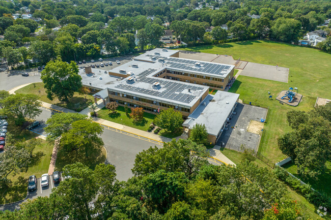 Solar panels adorn the roof of John Quincy Adams Elementary School.