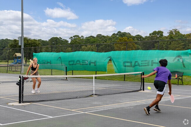 Play a round of pickleball at the Lake Mayer Park near Leeds Gate-Colonial Village.
