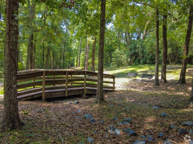 Residents of the neighborhood enjoy strolling through John G. Riley Park.