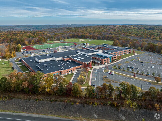 Older students attend Tolland Highschool which is a modern building on a spacious campus.
