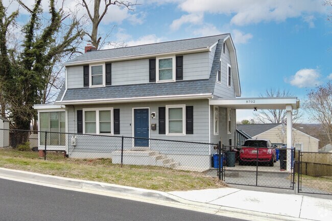 Colonial style homes in Berwyn Heights feature carport garages and fenced in yards.