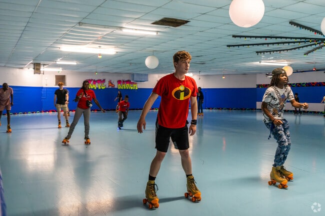 Guests at Skate Ranch in Wester show off their skating skills on the rink.