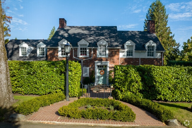 Trees shade a traditional home on S Military Ln in Dunthorpe.