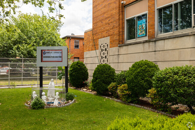 Religious statues adorn the entrance of Our Lady of Fatima School in Queens, New York.