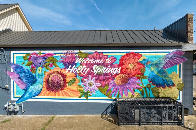 This colorful mural welcomes people to Holly Springs.