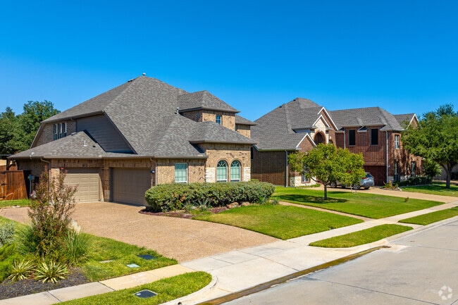 Stately brick homes line the residential streets of Highland Oaks.
