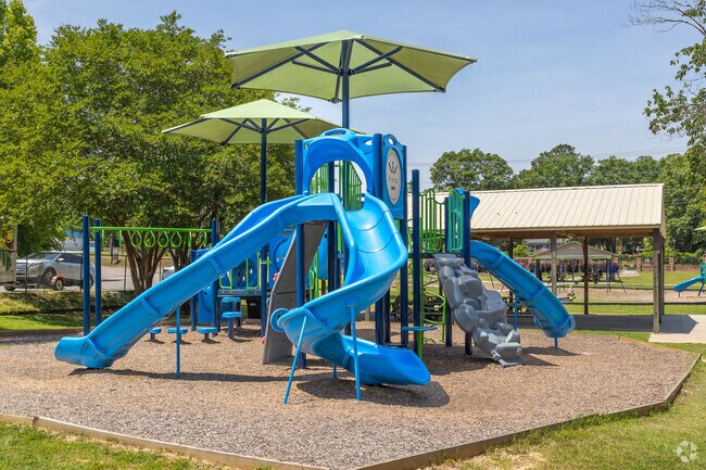 Fun playground activities at Felton C. Benton Park in Springdale.