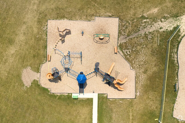 Woodland Elementary School in Gages Lake, Illinois includes multiple playgrounds.