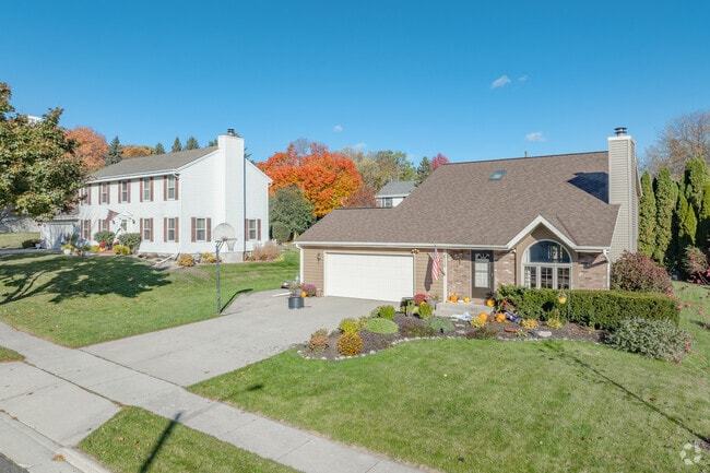 Saukville homes sit on quiet streets with driveways and mid-sized grassy yards.