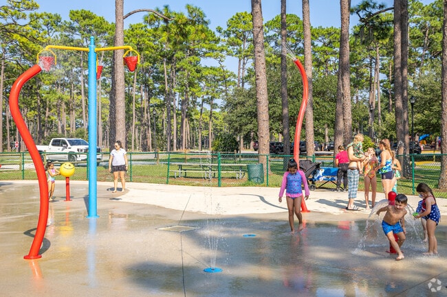 Children in Lincoln Forest enjoy the splash pad at Long Leaf Park.