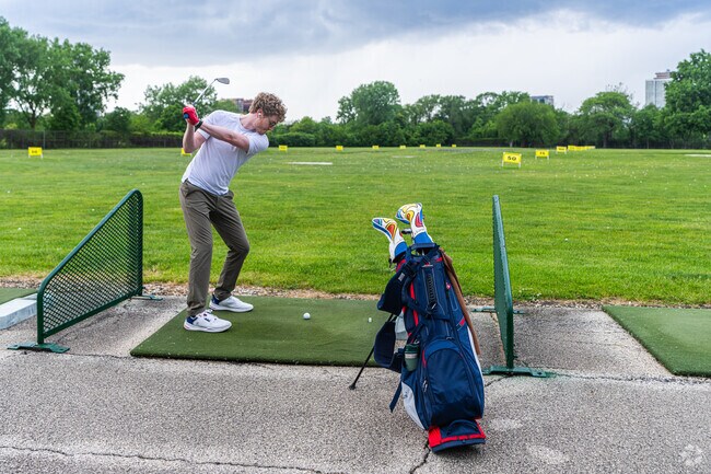 Golfers readily use the driving range and golf course at Jackson Park near West Woodlawn.