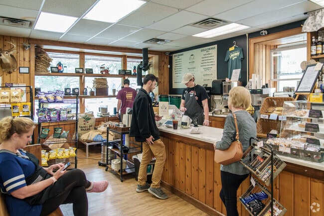 Residents queue at The Landenberg Store for sandwiches, deli goods, and on-site roasted coffee.
