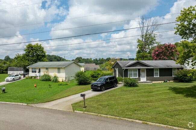 Quaint cottages and ranch-style homes dot the landscape in Amherst, blending charm with natural surroundings.