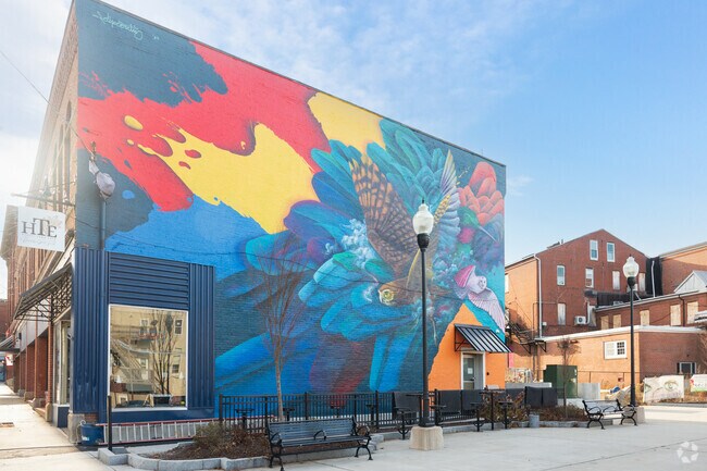 After having a bite at Honest Town Eats, enjoy its colorful art right outside with seating.