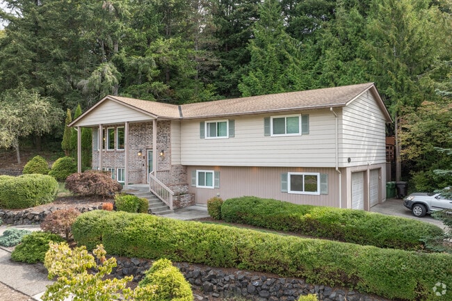 Beautiful mid-century split levels have lush front yards in Cascade-City View.