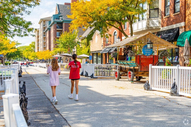 Arlington Heights locals stroll through the downtown area with outdoor seating.