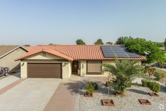 Most homes in Ocotillo have multi-car garages and well-kept yards.