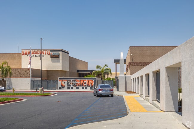 Parent Waits to Pick Up Student in Front of San Jacinto High School