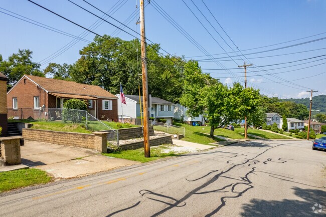 Many Fairywood homes feature well-kept exteriors and manicured yards.