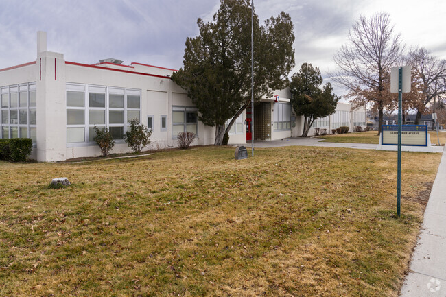 The grass lawn in front of Veterans Memorial Elementary School.