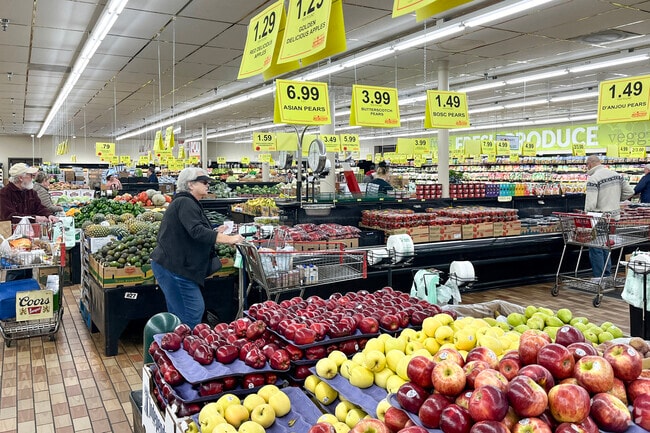River Crossing residents shop for fresh seasonal produce at their local Woodmans.
