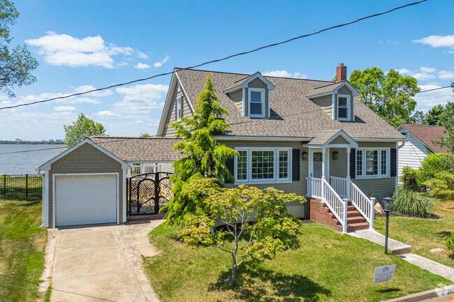A picturesque Cape Cod with dormer windows in Penns Grove.