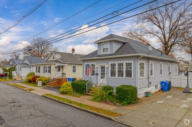 Charming Sewaren homes with tidy yards line this peaceful waterfront town.