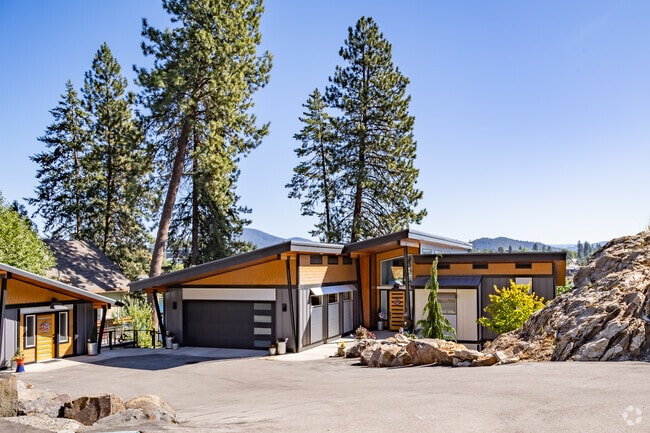 Homes with modern designs hang off the cliff with amazing views of the Spokane River.