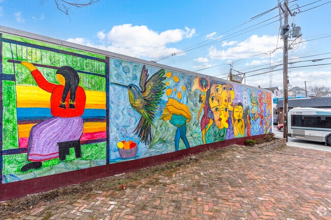 Marvel at the vibrant and diverse array of murals that adorn Central Falls, RI.