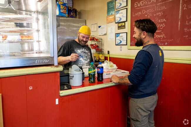 Dustin’s Pizzeria offers a relaxed spot for takeout and conversation, a cornerstone of downtown Holley dining.