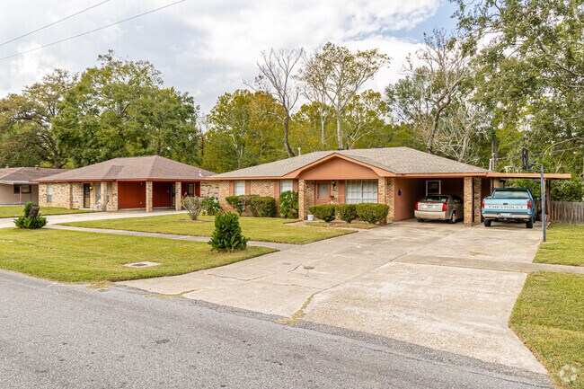 Many homes feature well-kept lawns and gardens, adding to the neighborhood’s charm.