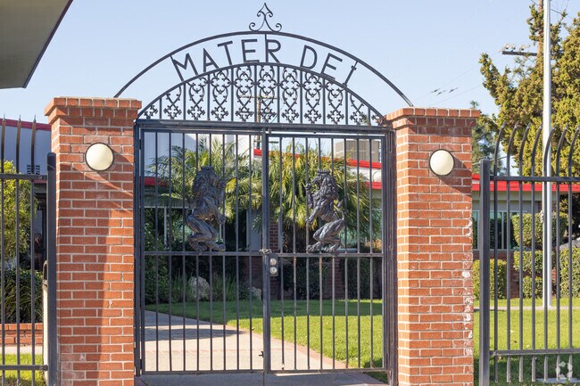 Mater Dei High School in Delhi features a brick and iron gate that marks its formal entrance.