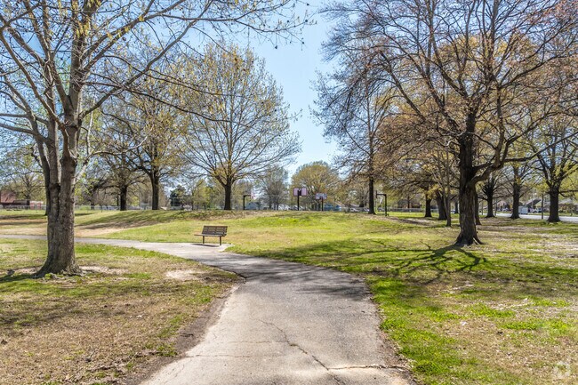 Enjoy a stroll on the paved walking path at Lewis Davis Park in Memphis.
