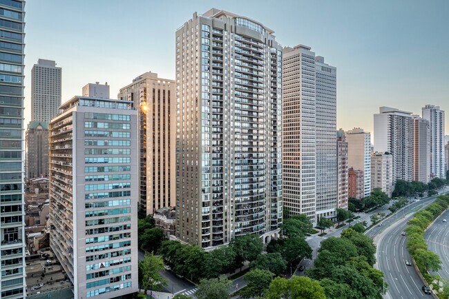 Mid and Highrise condos line the shores of Lake Michigan as the sunsets over the Mag Mile.