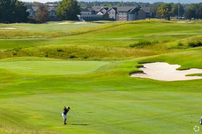 The River Course near Hampton Cove features 16 water hazards across 18 scenic holes.
