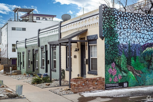 These traditional apartments in Jefferson Park are decorated by a colorful mural.