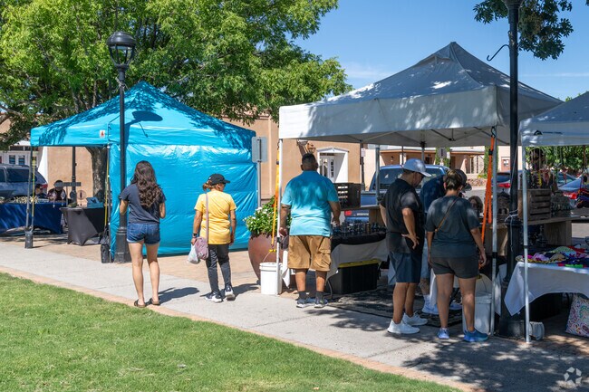 People enjoy walking around the Old Mesilla Farmers and Crafts Market in Mesilla.