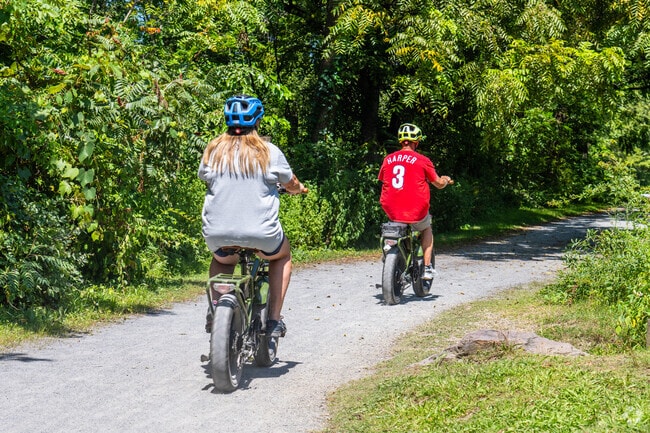 Locals ride bikes through Lehigh Canal Park on the D&L Trail.