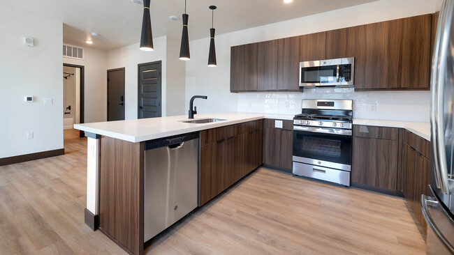 Kitchen with Quartz Countertops and Stainless Steel Appliances