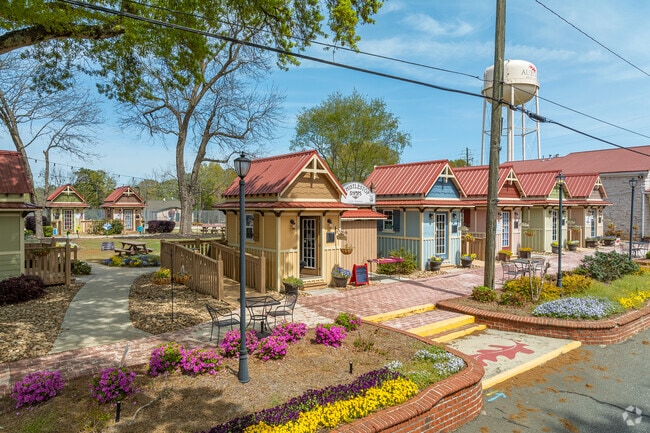 Each week, shoppers from near and far flock to the charming, quaint retail cottages of the Whistlestop Shop, drawn in by their unique offerings and warm atmosphere.