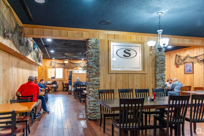 Strickland's Seafood Restaurant serves fresh fried alligator near Deer Lick Place.