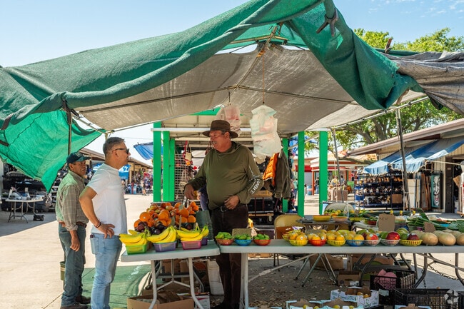 Visitors can purchase fresh produce from vendors at Traders Village.
