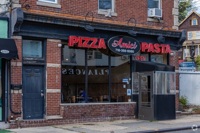 Amici Brick Oven Pizza serves pizza, calzones, and other Italian specialties.