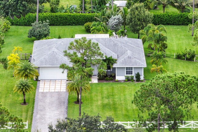 Some parts of The Acreage still reflect its rural character, with ranch-style homes and open fields.