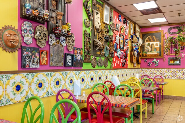 Los Girasoles serves Latin cuisine in art-filled space with vibrant walls near Lords Park.