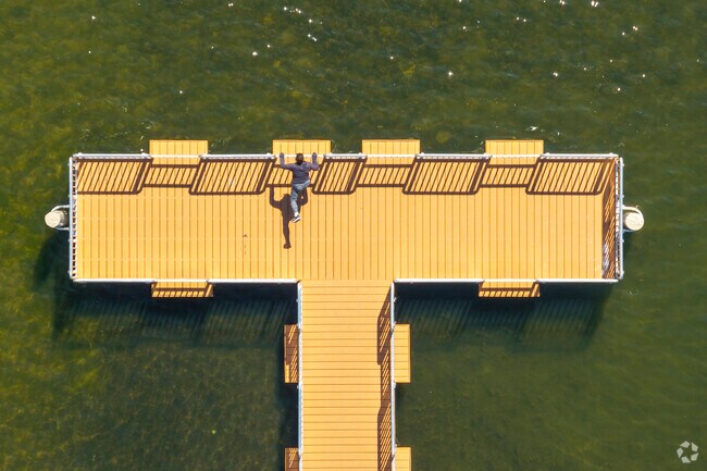 Residents of Bridlewoods Park use the Paulus Park pier to exercise and enjoy the sun.