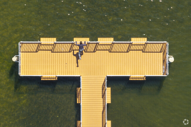 Residents of Bridlewoods Park use the Paulus Park pier to exercise and enjoy the sun.